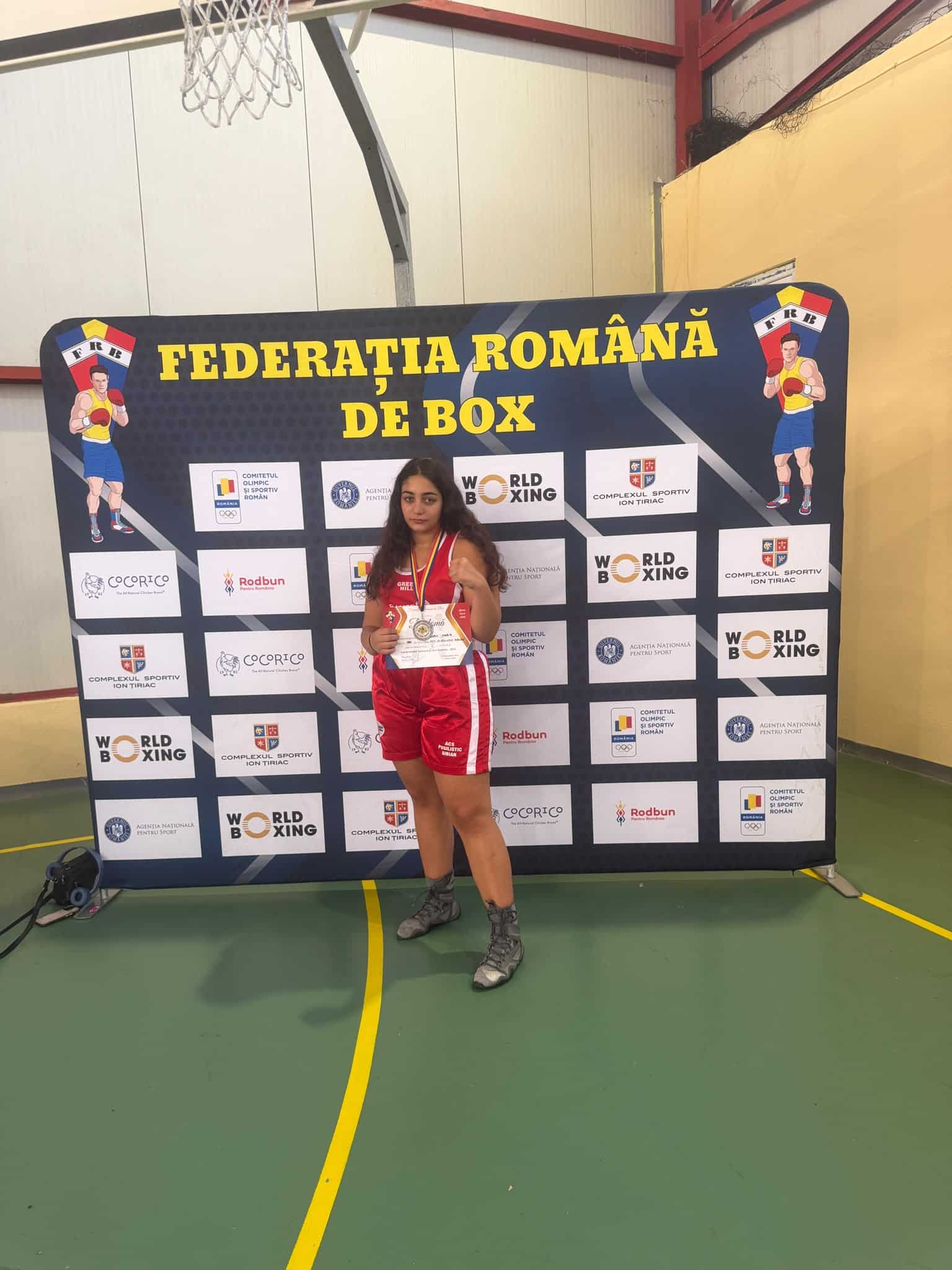 Sportivă cu medalie la box